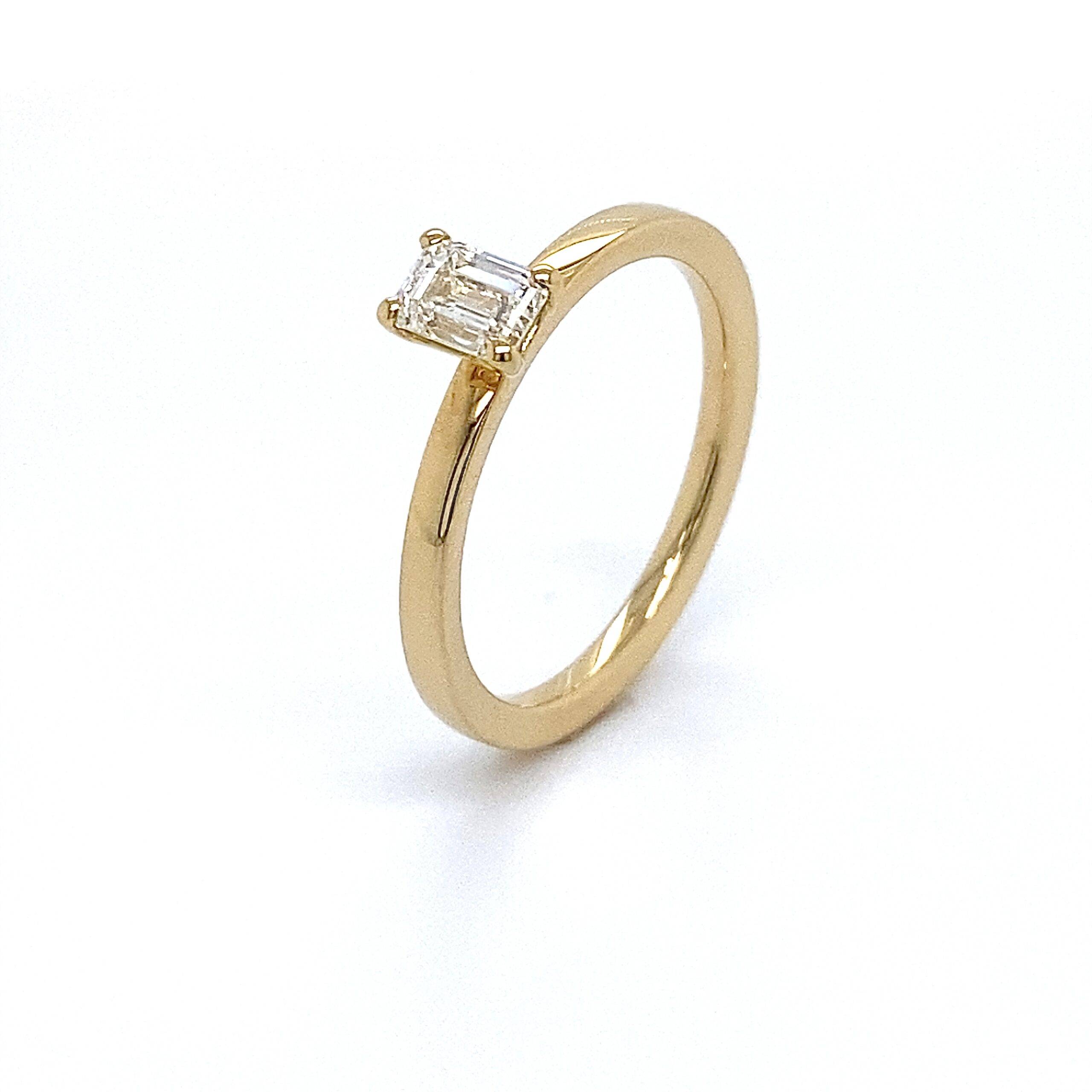 Ring solitair met baguette 0.50crt SI Wesselton 14k geelgoud