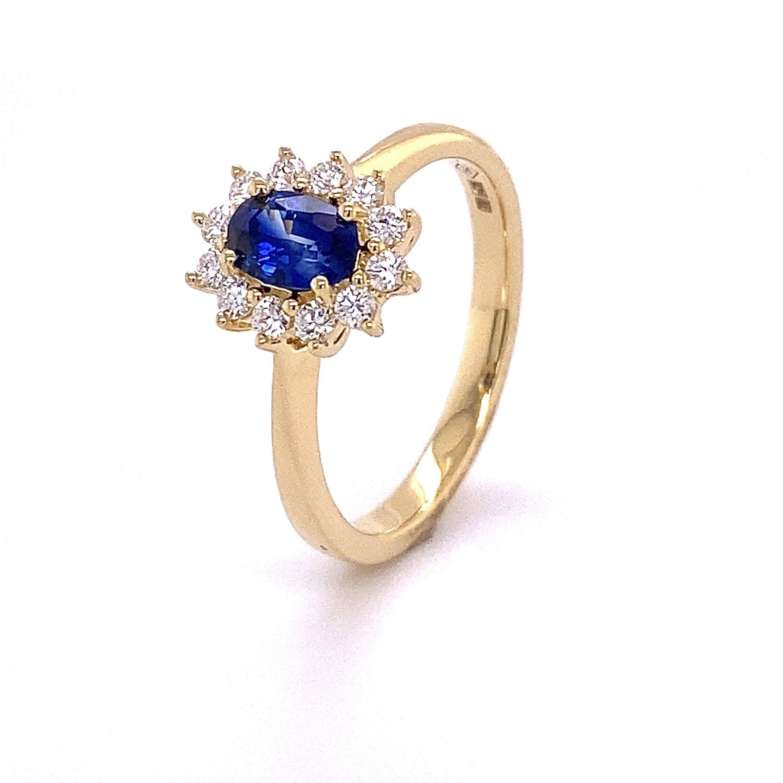 Entourge ring 'Lady Di" blauw saffier en diamant 0.26 Si Wesselton 18k geelgoud