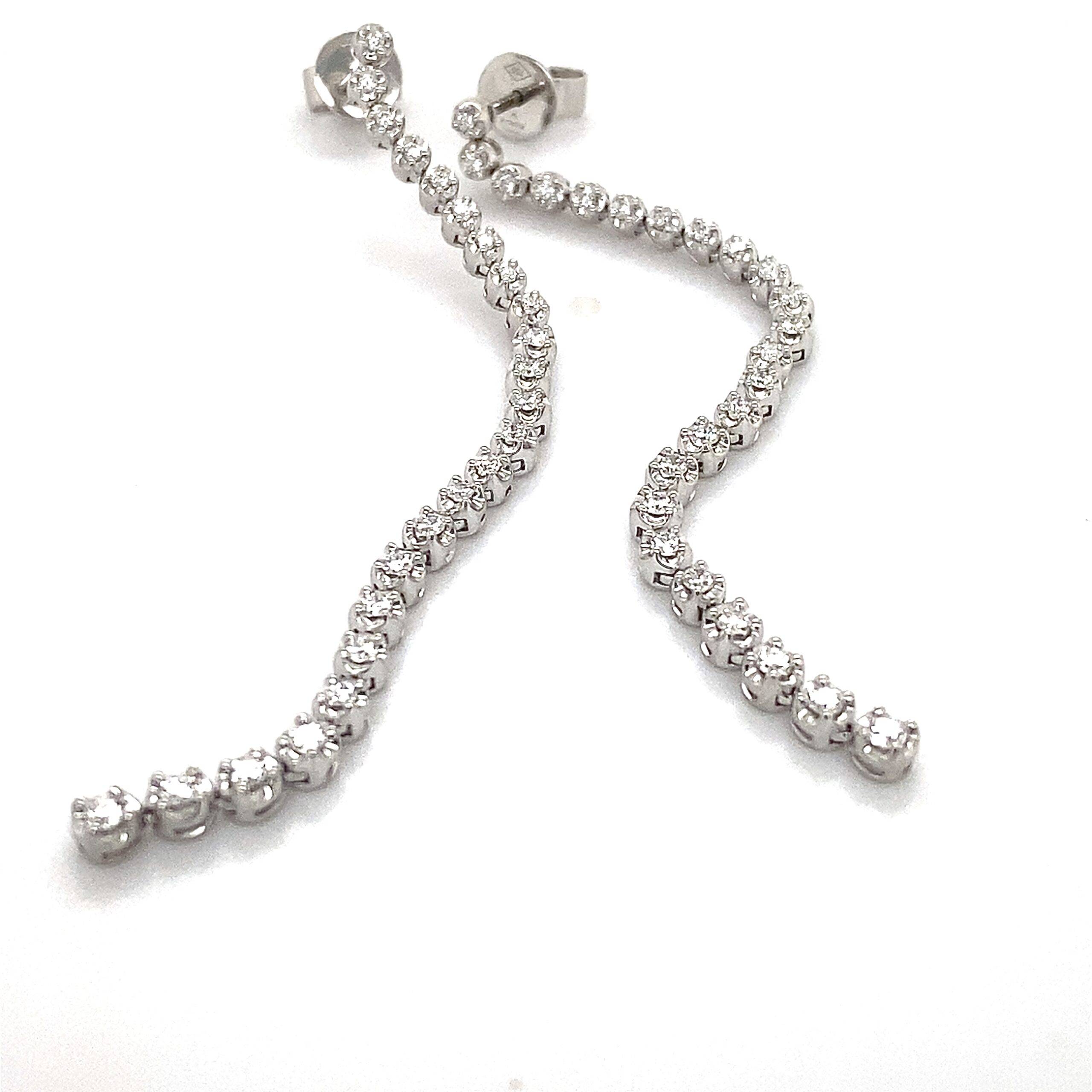 Oorhangers tennis model 18k witgoud diamant 0.57 Si Wesselton 65mm